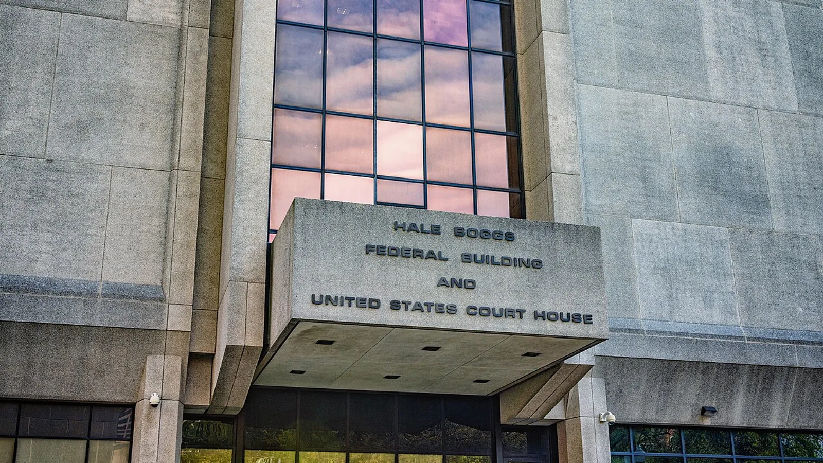 Exterior and entrance sign of the Hale Boggs Federal Building and United States Courthouse in Louisiana, photographed in 2020.